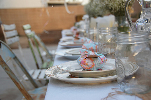 Backyard party table setting with favors