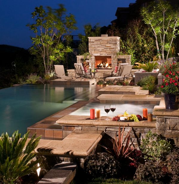 Contemporary Jacuzzi and pool with sizzling fireplace lighting up the space