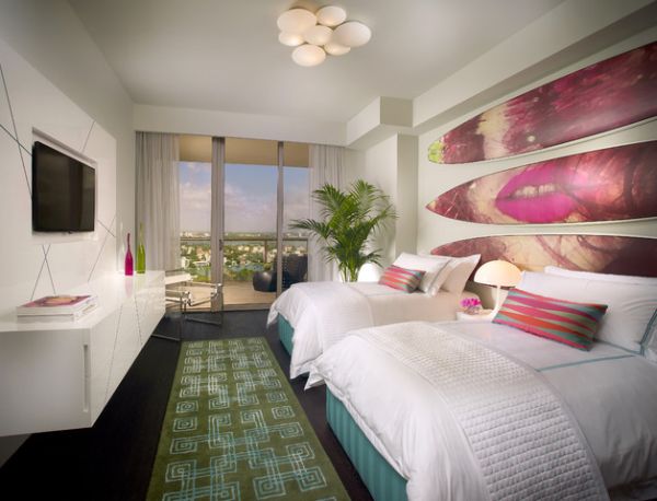 Contemporary bedroom with painted surfboards on the wall