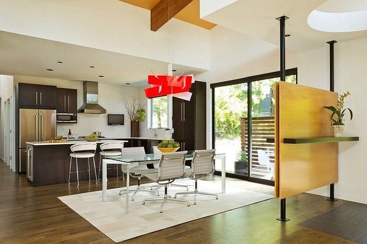 Dining area and modern kitchen inside the Hollcroft Residence