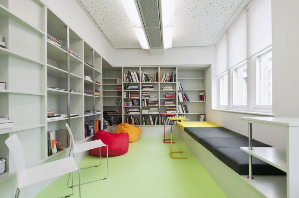 Splashes of red, orange, yellow and black in this beautiful minimalist office