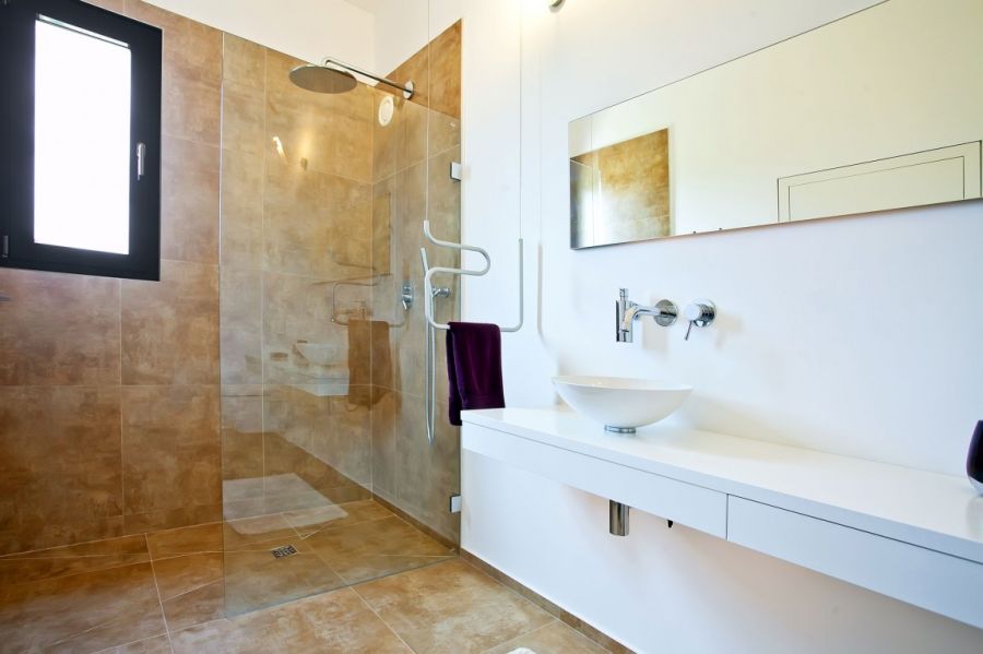 Glass shower area in the modern bathroom