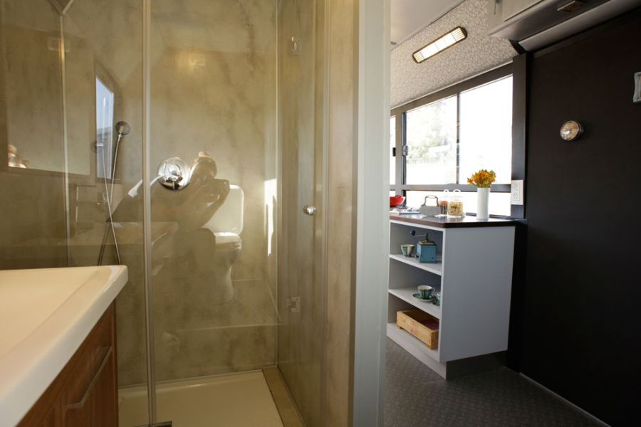 Glass shower enclosure in the bus