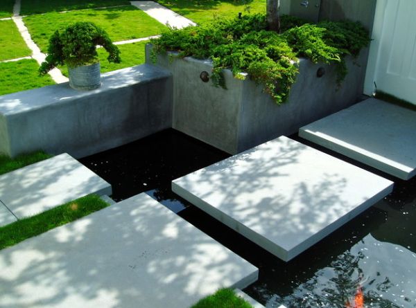 Koi pond in front yard with stylish floating steppers