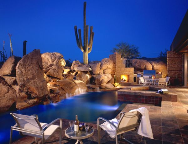 Lighted rocks and cactus create a desert setting