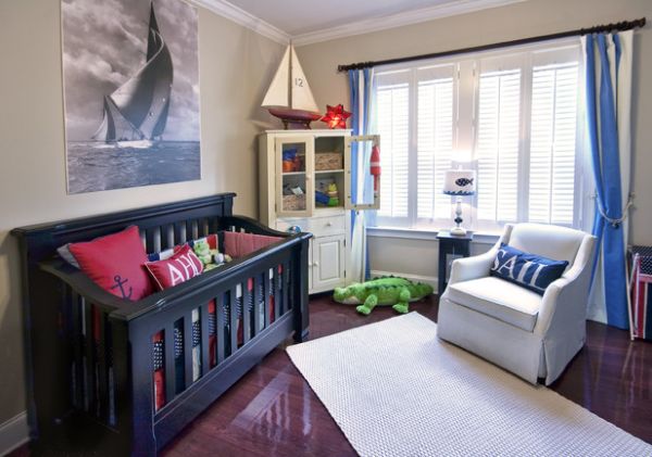 Nautical theme accentuated with sailboat motic in kids' bedroom