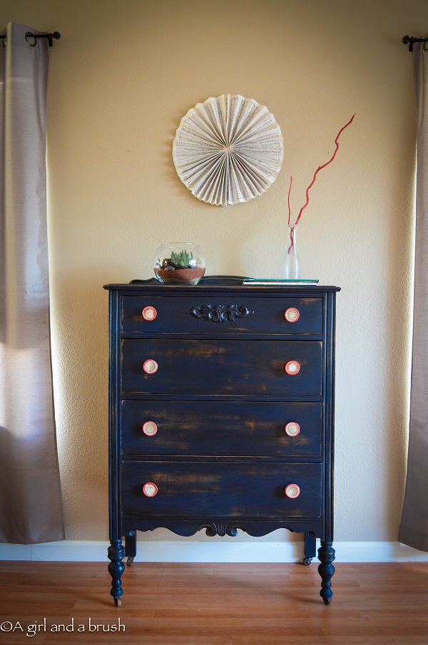 Navy blue dresser with red handles