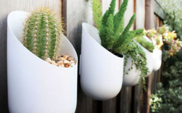 Oval planters add life to the fence