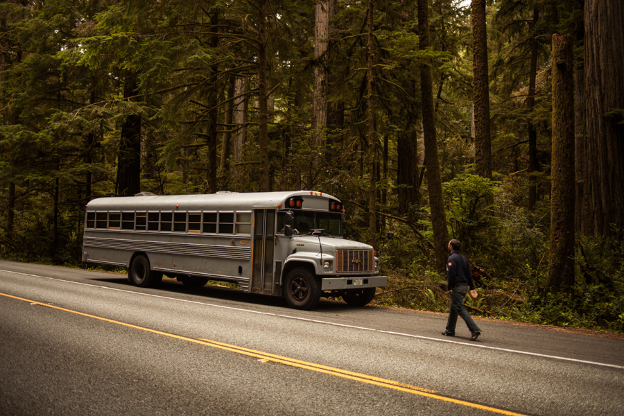 Restored Bus Mobile Home parked next to the highway