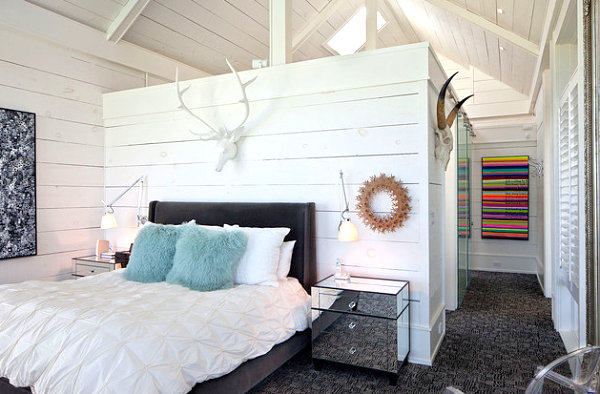 Rustic bedroom with neon artwork