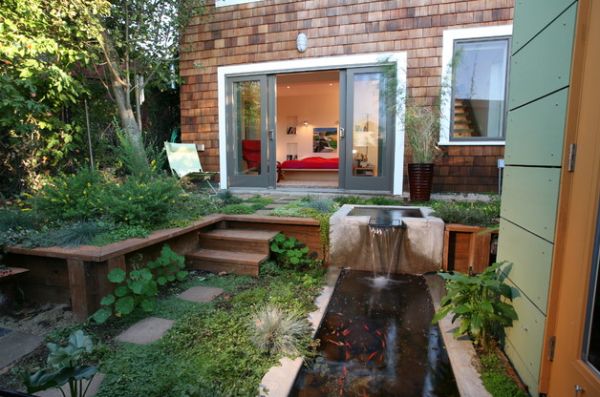 Sleek koi pond beneath the small waterfall