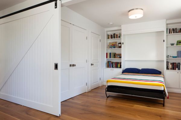 Sliding door and Murphy bed create a bedroom out of an open niche