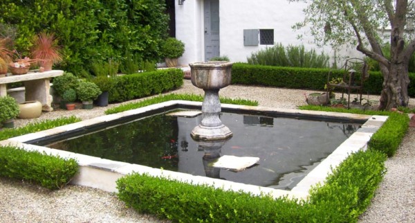 Square koi pond with lovely boxwood border