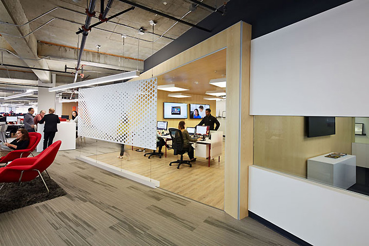 Orange open seating to the left in contrast to conference rooms