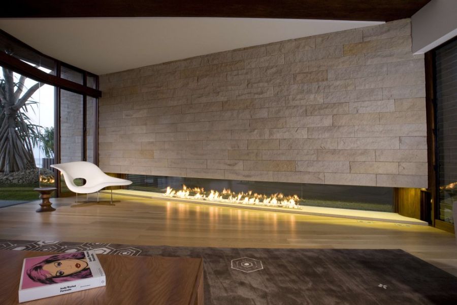 Stone fireplace and Eames Chaise