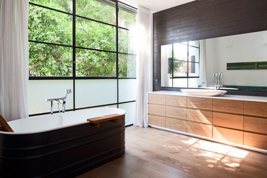 Stylish bathroom with large windows