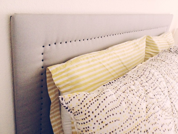 Upholstered headboard with nail heads