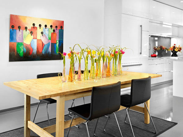 Vases of tulips in a contemporary dining space