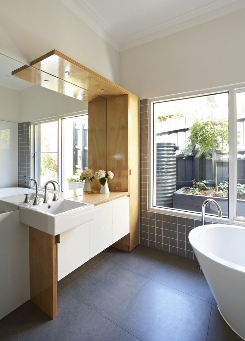 White bathroom with wooden tones