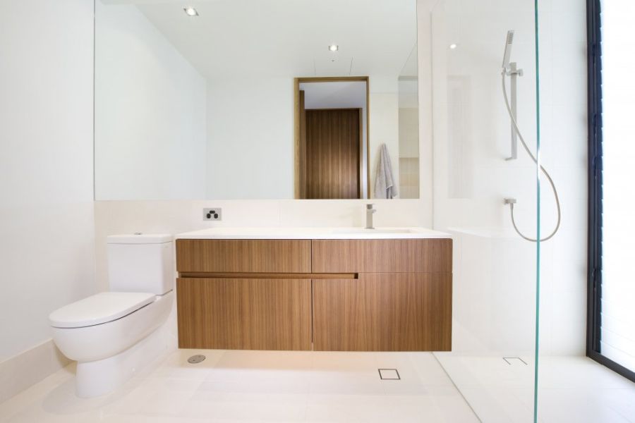 Wooden cabinets in modern bathroom