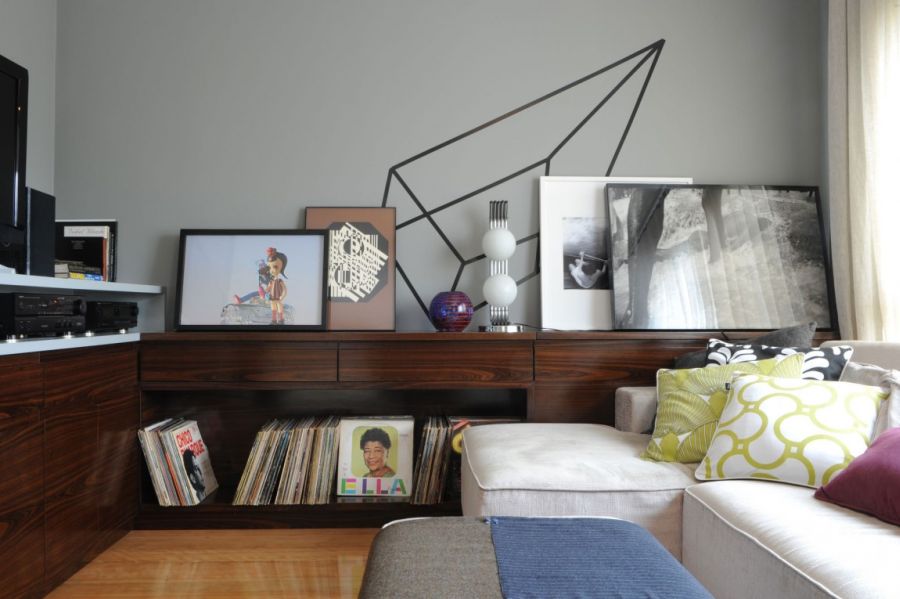 Wooden shelves double up as siplay space