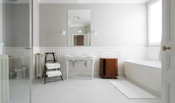 All white bathroom with a dash of subtle wooden accents