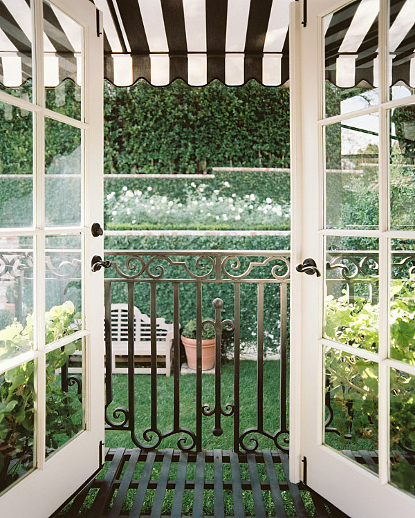 Balcony with a striped awning