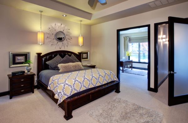 Bright yellow pendants add a hint of color to the bedroom