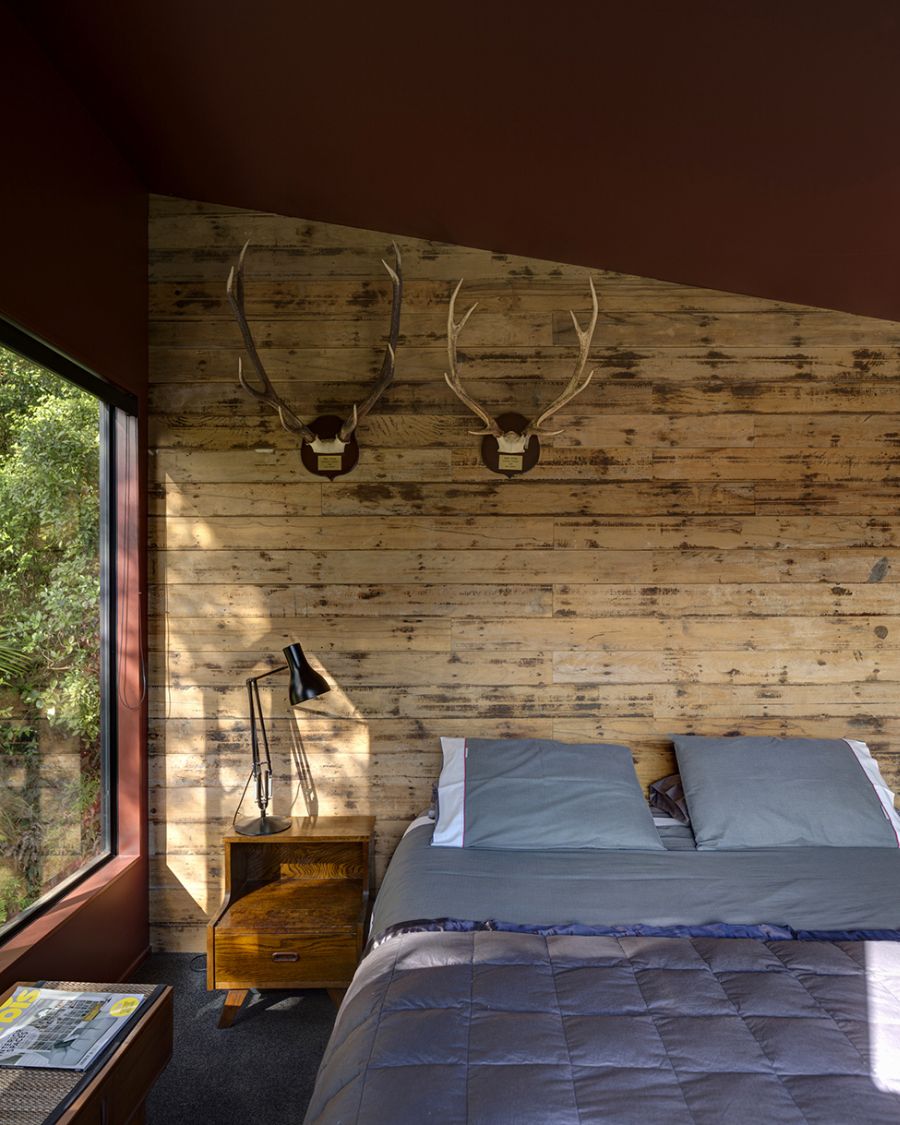 Cabin-styled comfortable bedroom in the New Zealand home