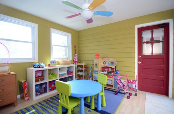 Charming little fan accentuates the color scheme of the playroom