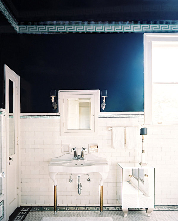 Chic bathroom with mirrored storage piece