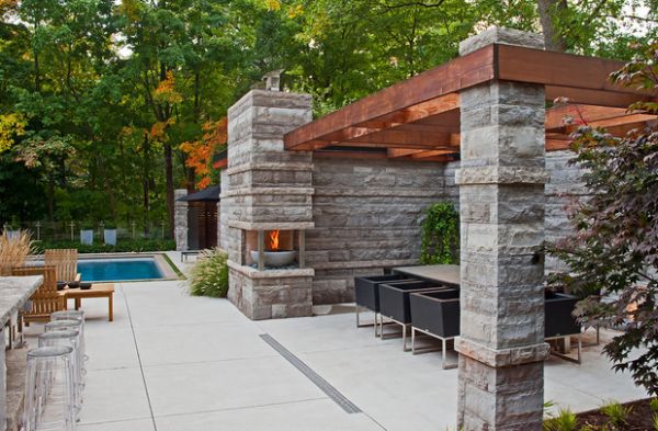 Contemporary fireplace next to the pergola reminds us of the Olympic spirit!