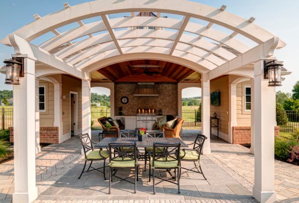 Curved pergolas offer geometric contrast to the facade of your home