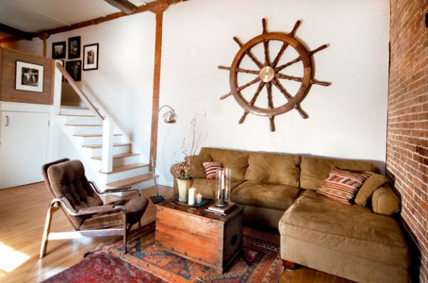 Eclectic living room with exposed brick wall and a large ship wheel!