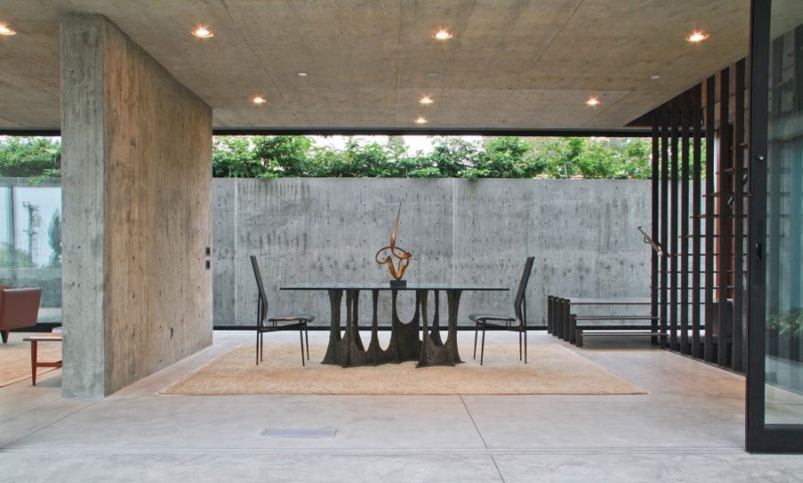 Exposed concrete walls and dining area