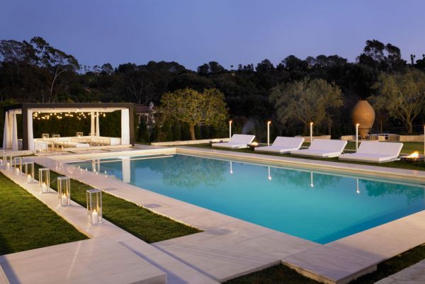 Exquisite pool and pergola design with some amazing lighting!