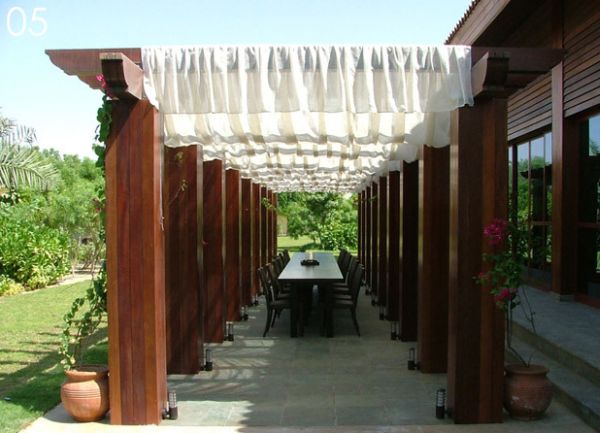 Fabric instantly softens the look of the pergola