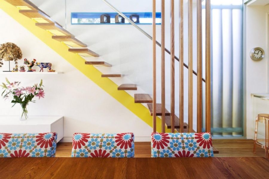 Floating staircase with pops of yellow