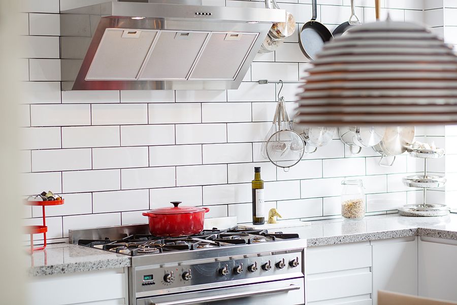 Hints of red accents in  the kitchen through cookware