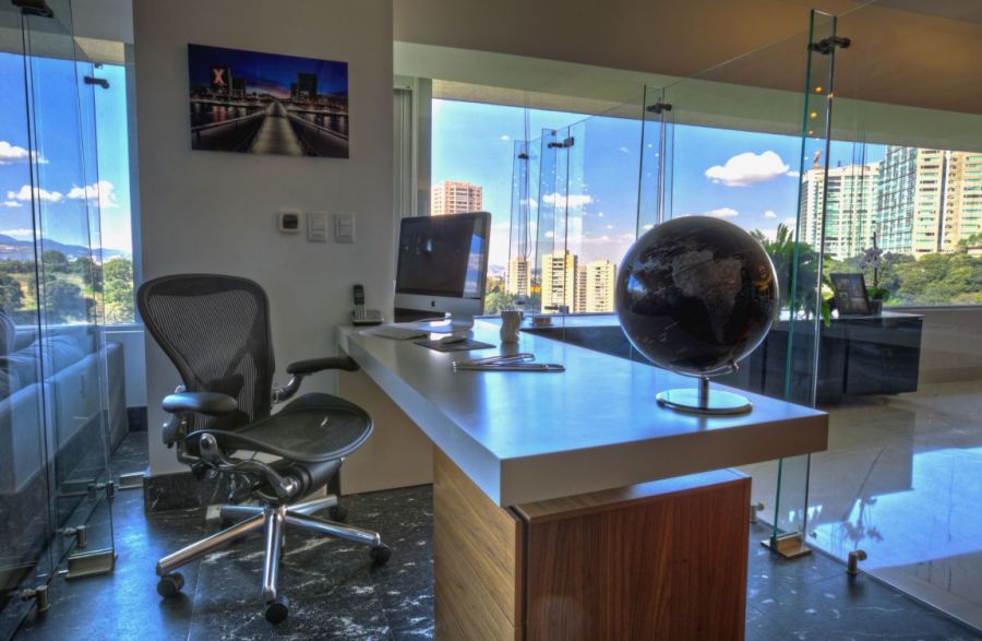 Home office concealed in glass