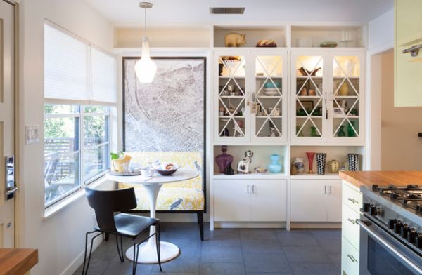 Lovely dining space with Tulip dining table and bench covered in yellow toile design