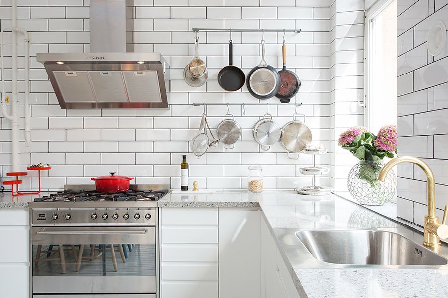 Marble kitchen countetops complement the pristine white walls