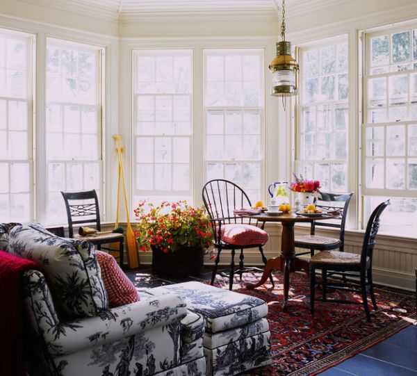 Outdoor porch with chair and ottoman in toile fabric