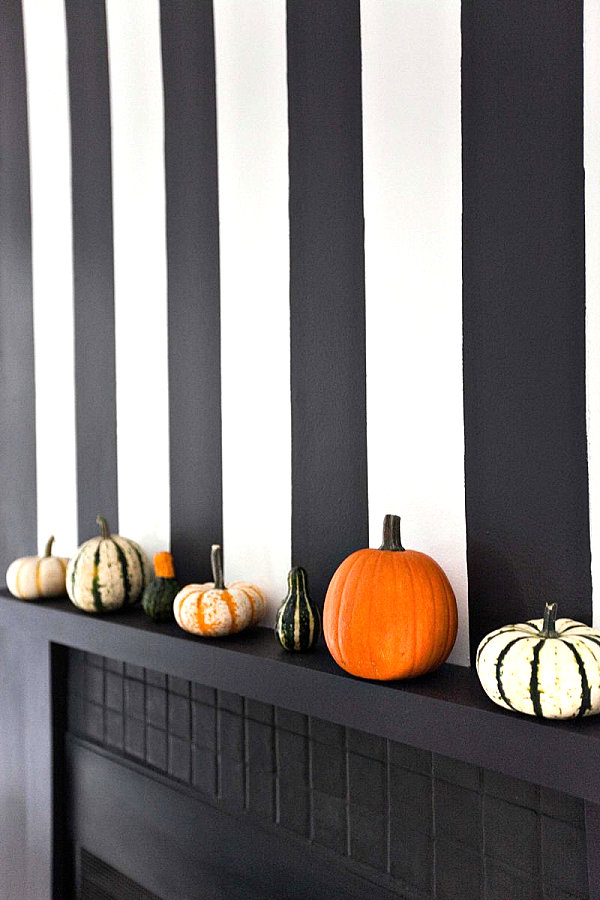 Pumpkins and squash on a mantel