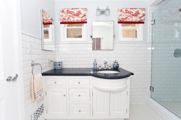 Red on white toile design warms up the bathroom in white