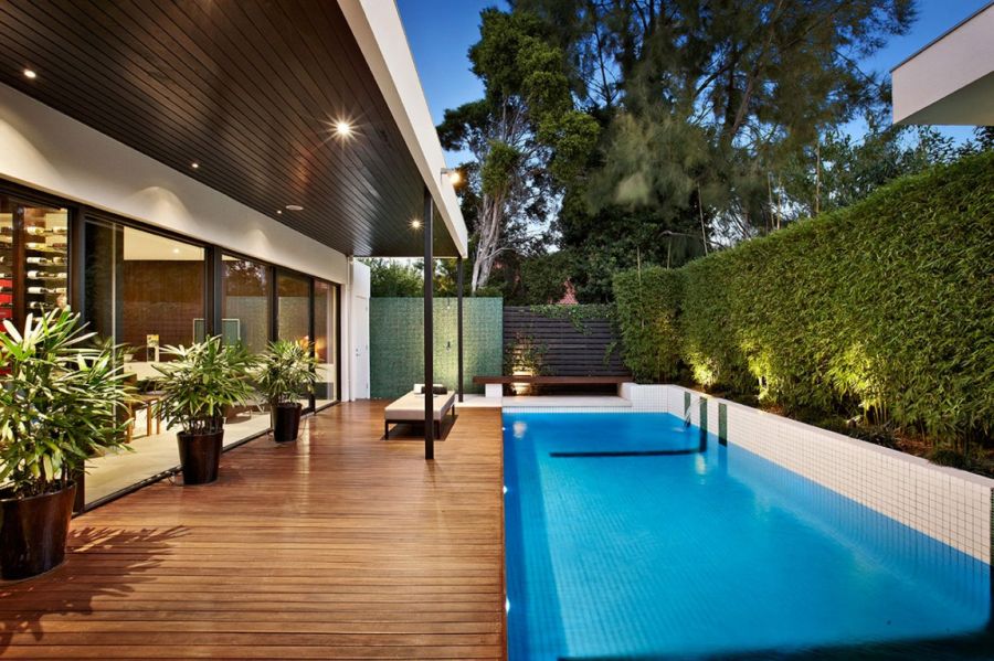 Refreshing pool with a greenery next to it