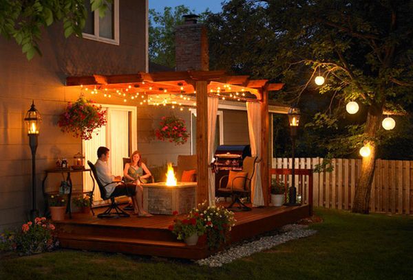 Simple patio pergola with fireplace at its heart - For those romantic evenings outdoors!