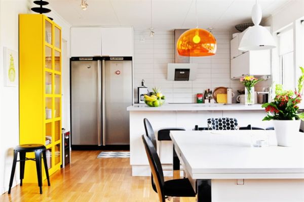 Sizzling orange brightens the kitchen in white