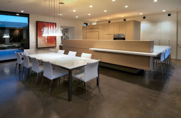 Sleek lineup of the Fucsia pendant lights above the dining area