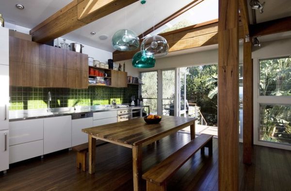 Trio of FLY pendant lights in a rustic kitchen